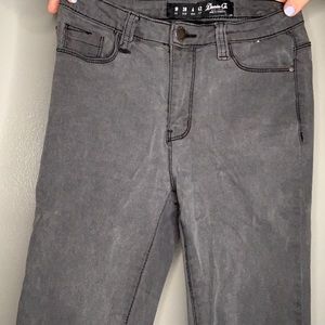 Distressed Black Jeans With Rips